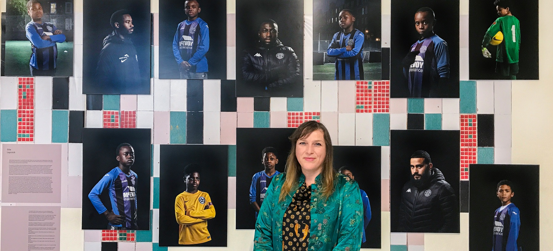 Photographer Ellie Laycock with her photos of St Matthews football coaching team representing 'leadership'