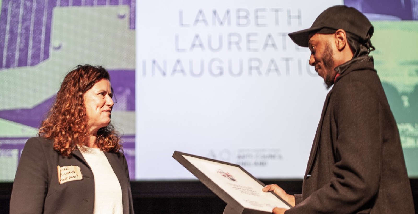 Cllr Holland hands certificate as Lambeth's first poet laureate to Abstract Benna at Southbank Oct 27 2022