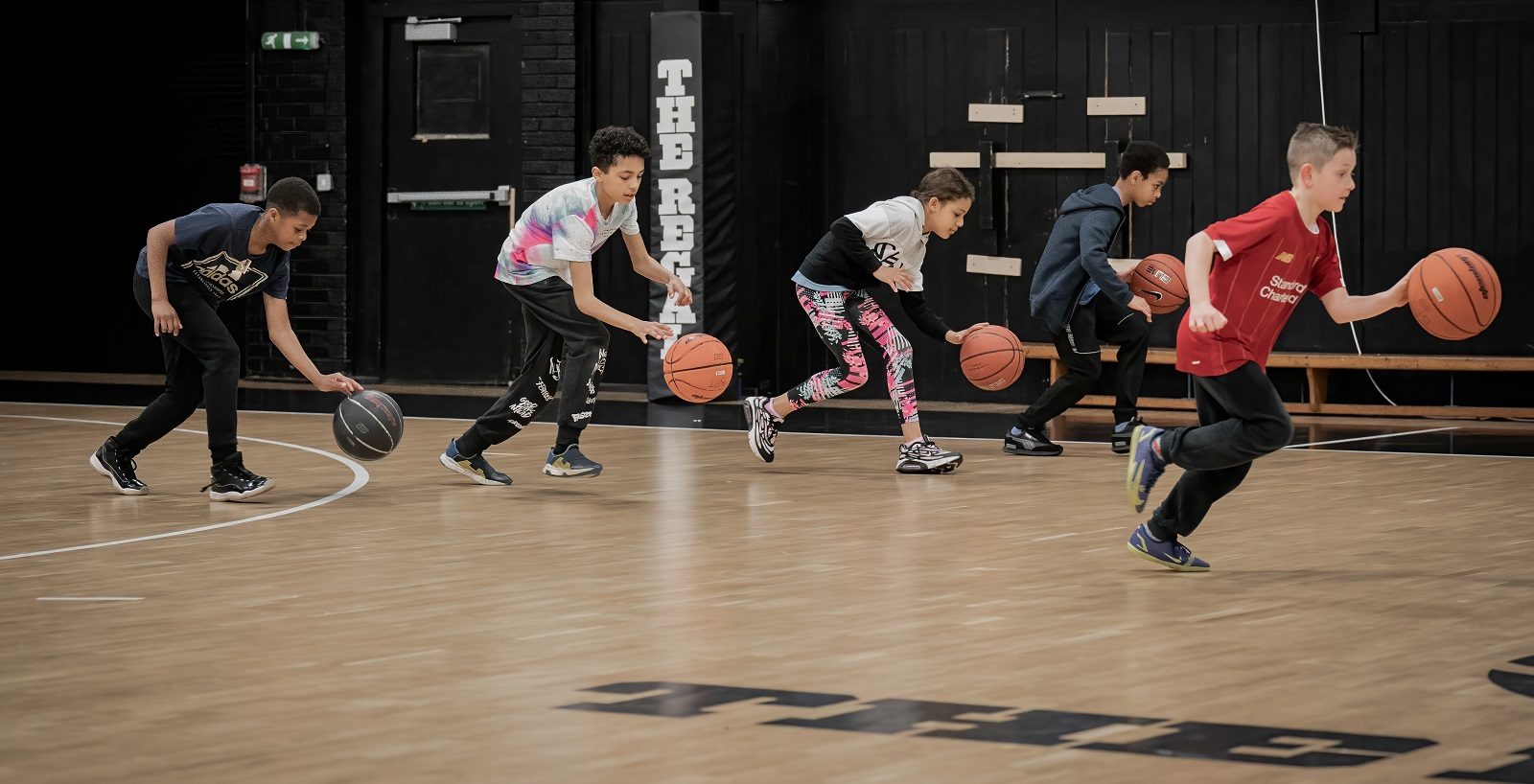 young people playing basketball on the Black Prince Trust's 'Regal' court - the subject of a successful crowdfunder appeal