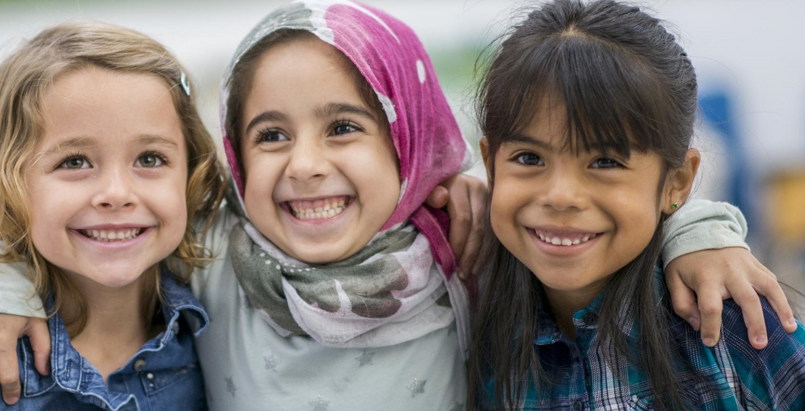 stock photo of 3 children hugging used on home page of new Lambeth Sanctuary Services web pages