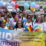 Lambeth Council councillors & staff hold 'Officially home of the largest LGBTQ+ population in London' banner on Pride March, 1 July 2023 