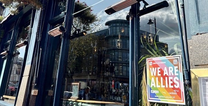 LGBT allies rainbow sticker in the window of a bar in Lambeth