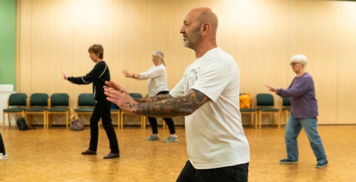 maleinstructor with 3 older ladies in keep fit class - image from Ageing Better Library