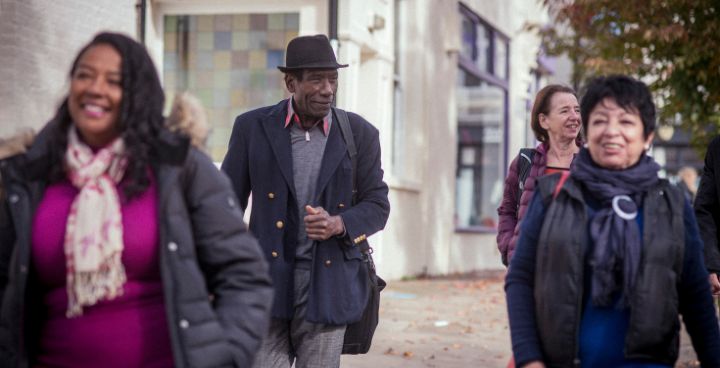 phto from centre for ageing well showing 4 people walking towards camera