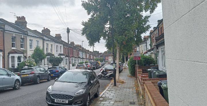 Street in Lambeth with houses, parked cars and trees