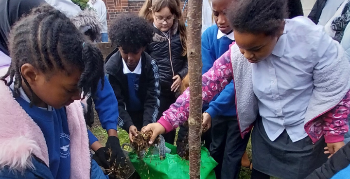 Loughborough Primary School pupils plant a tree in memory of Benjamin Zephaniah - the first tree of 2024 tree planting season