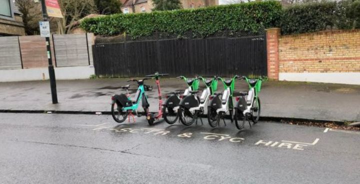 Dockless bikes parked up in a road side parking bay