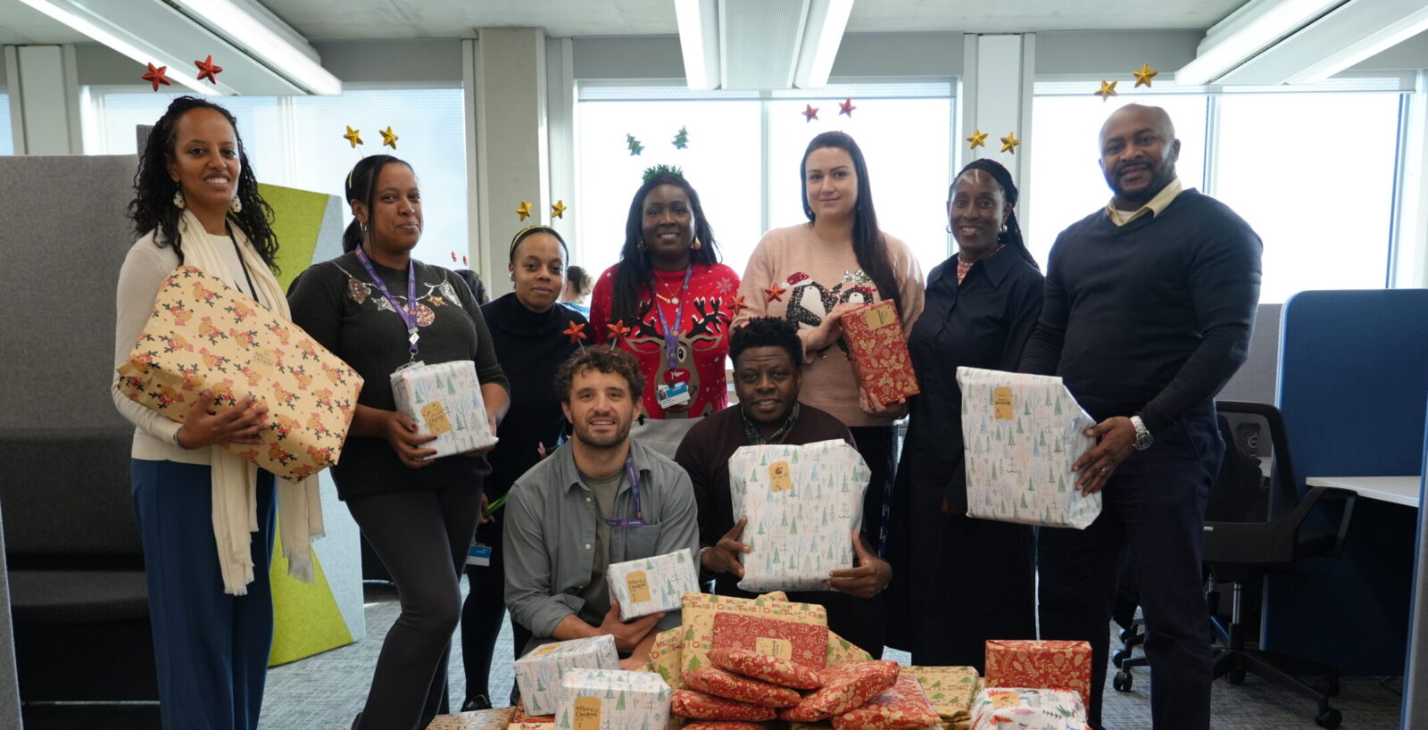 Lambeth Council staff with wrapped Christmas presents