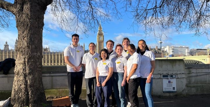 Guy's and St Thomas' Healthy Weight Living Team in white t shirts pictured with houses of parliament in the background