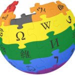 Wikipedia 'world' logo in rainbow colours as a jigsaw with missing pieces