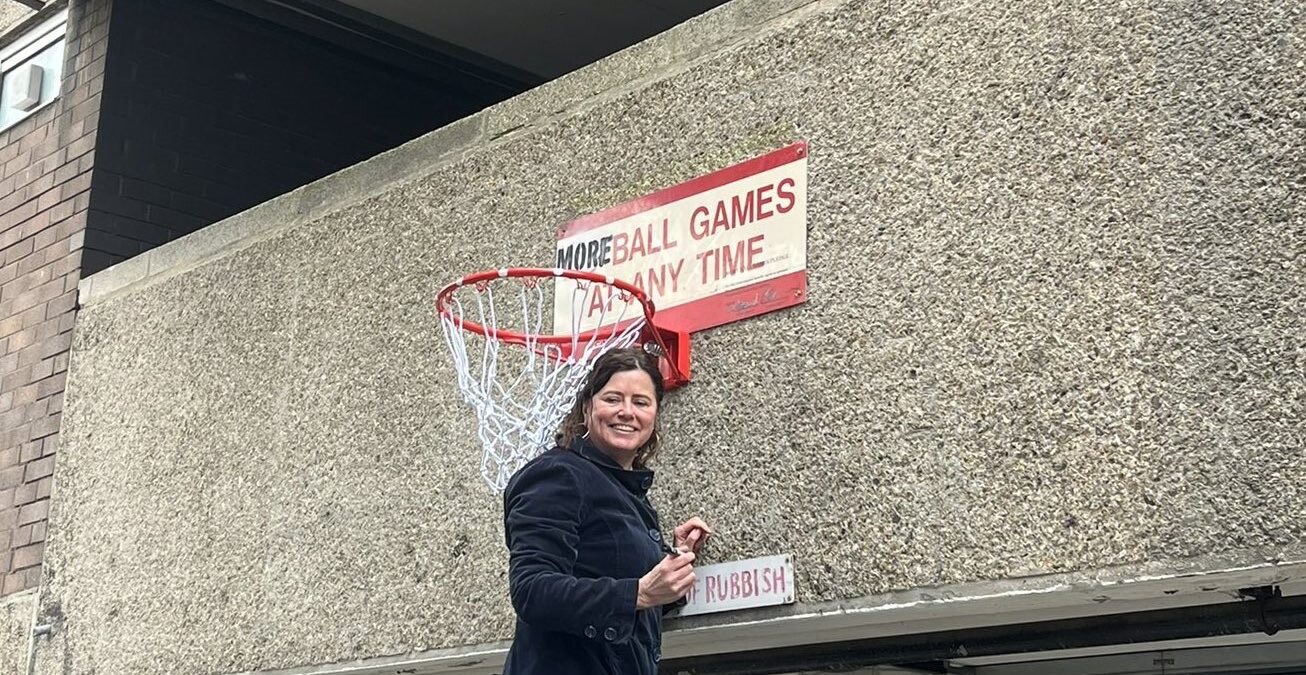 Cllr Claire Holland with a more ball games sign in Stockwell