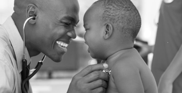 library photo of doctor with stethoscope and baby smiling