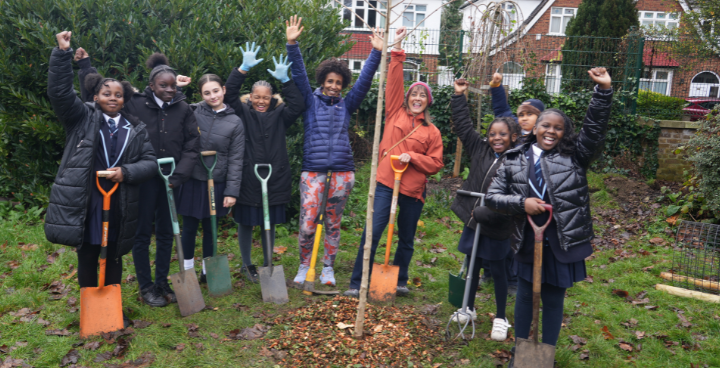 Cllr Rezina Chowdhury planting a tree with pupils from St Lukes Primary School, West Norwood