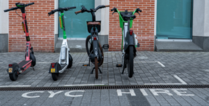Bikes and scooters parked in a dockless bay