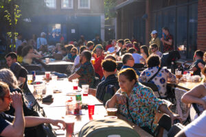 people sat at long tables, celebrating Portugal Day
